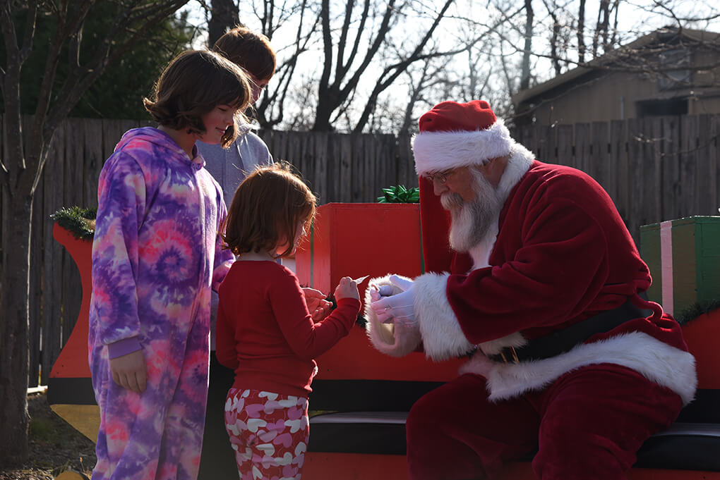 santa speaking with children